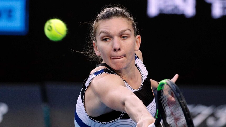 Simon Halep stretches to her left as she attempts a backhand return against Venus Williams.