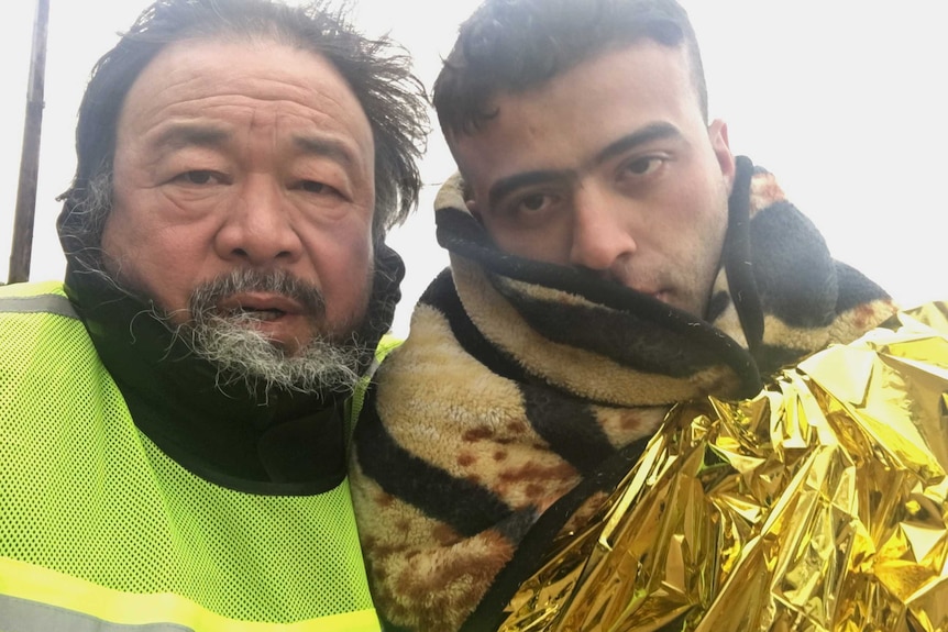Ai Weiwei with a refugee on the Greek Island of Lesvos.
