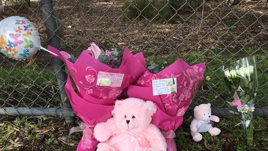 People leave flowers and teddy bears near the area toddler Sanaya Sahib's body was found