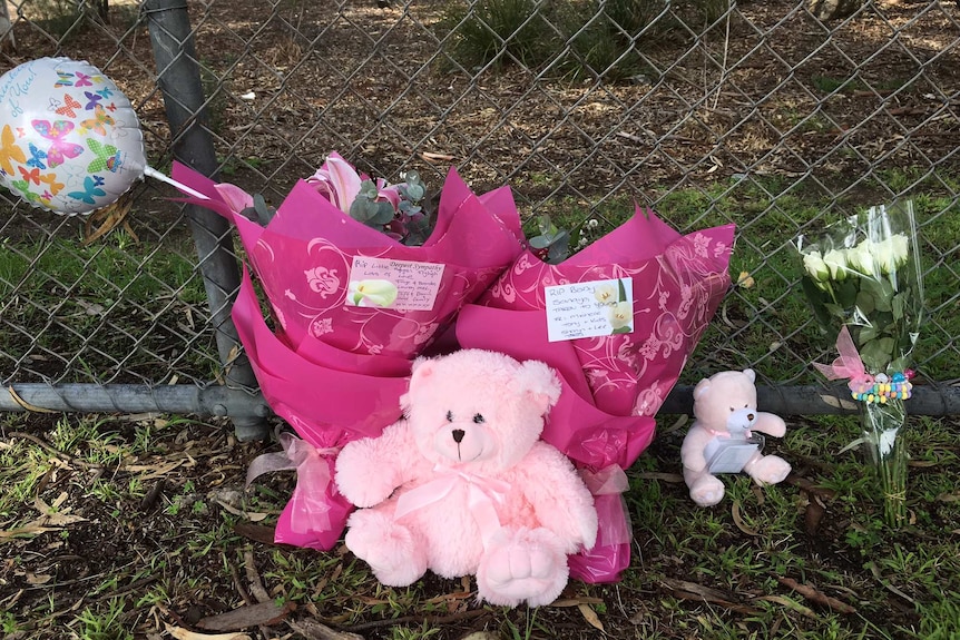 People leave flowers and teddy bears near the area toddler Sanaya Sahib's body was found