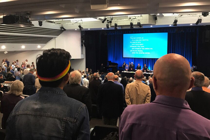LGBT Anglicans watch Sydney Synod proceedings from the public gallery at Wesley Theatre in Pitt Street.