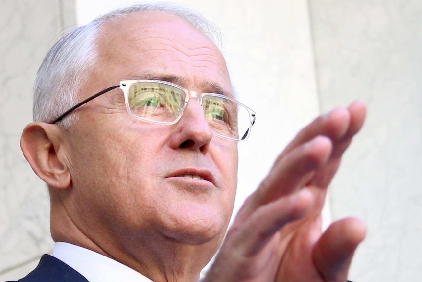 Malcolm Turnbull speaks at a lecturn.