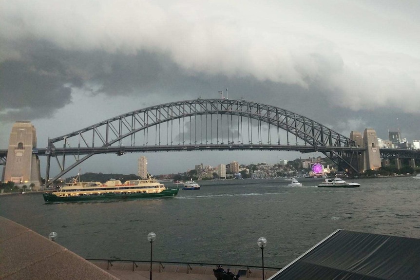 A stormfront surges towards the Sydney Harbour Bridge.