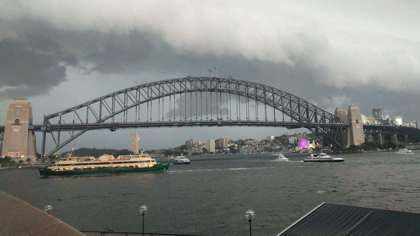 A stormfront surges towards the Sydney Harbour Bridge.