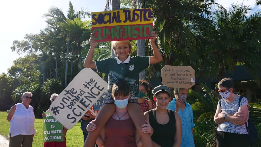 Local climate activits protest outside the council chambers