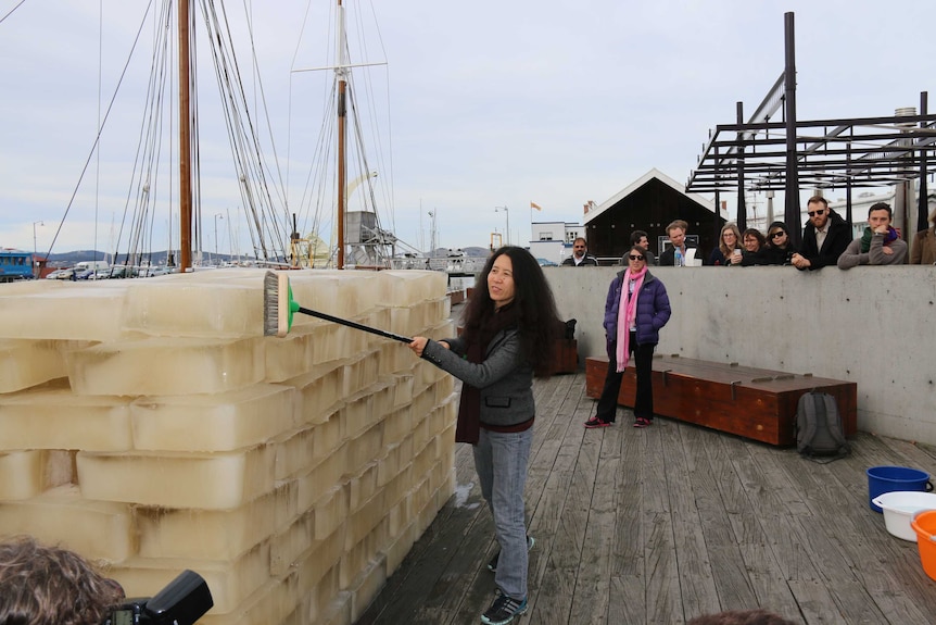 Chinese contemporary artist Yen Xiuzhen symbolically cleansing the Derwent River in Dark Mofo installation Washing River