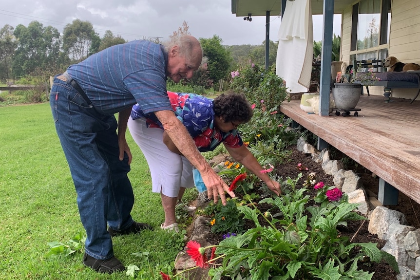 Barry and Jill Mitchell tending to their garden