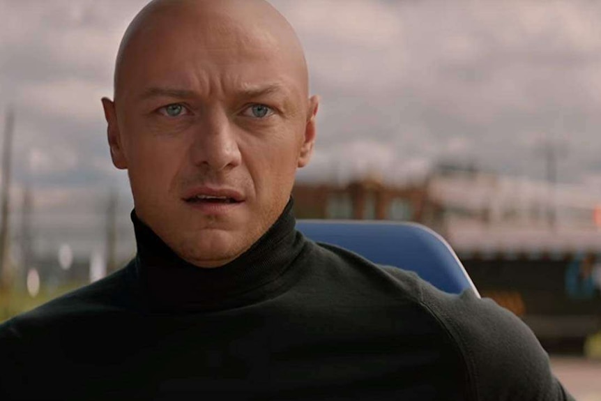 James McAvoy looks to the distance with turtle neck and bald head