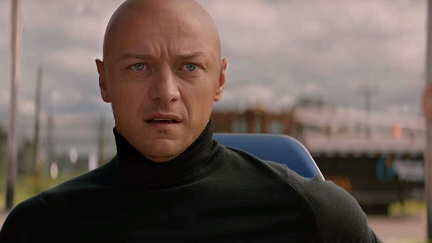 James McAvoy looks to the distance with turtle neck and bald head