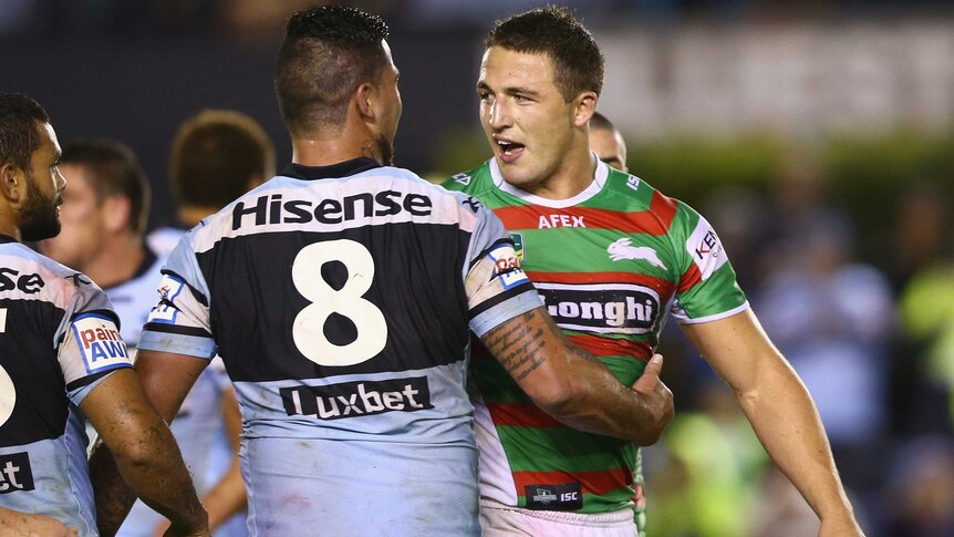 Andrew Fifita of the Sharks and Sam Burgess of the Rabbitohs exchange heated words