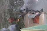 Flames pour out of block of flats in Lockridge after explosion ripped apart one unit