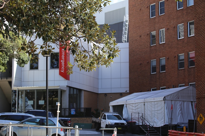 A large white tent stands outside the entrance to Wollongong Hospital