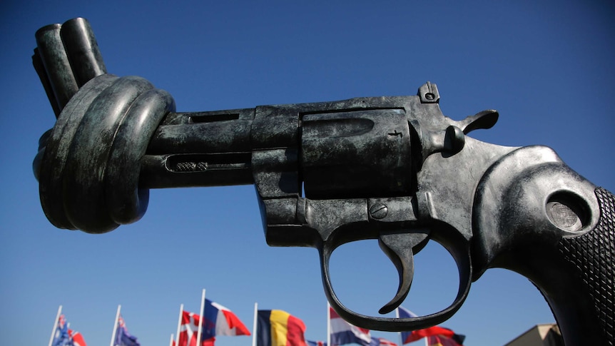 A bronze sculpture of a knotted gun entitled Non-Violence.