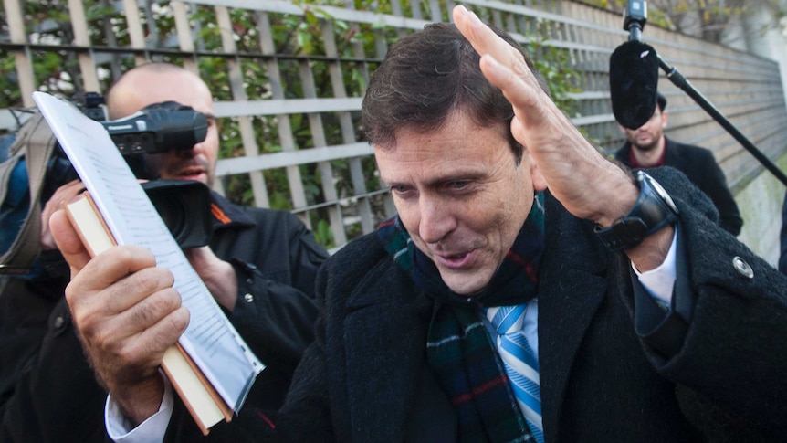 Doctor Eufemiano Fuentes arrives at court in Madrid for his "Operation Puerto" trial.