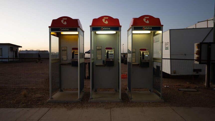 Three Telstra pay phones in Birdsville