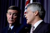 Series of inquiries: Air Chief Marshal Angus Houston listens to Defence Minister Stephen Smith during a press conference.