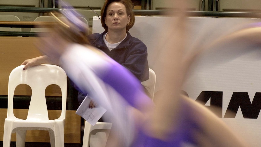 Peggy Liddick watches on intently while sitting in the stands