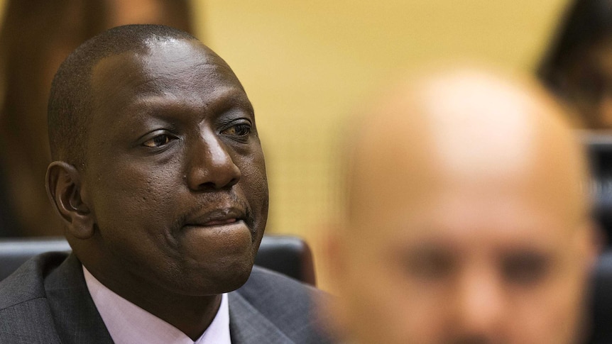 William Ruto listens at his trial in The Hague.