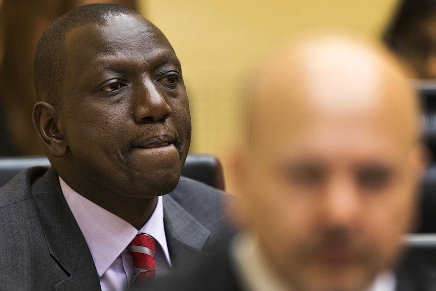 William Ruto listens at his trial in The Hague.