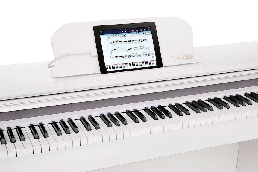 Smart piano with device attached.