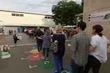 Voters line up on their way in to the polling booth in Adelaide