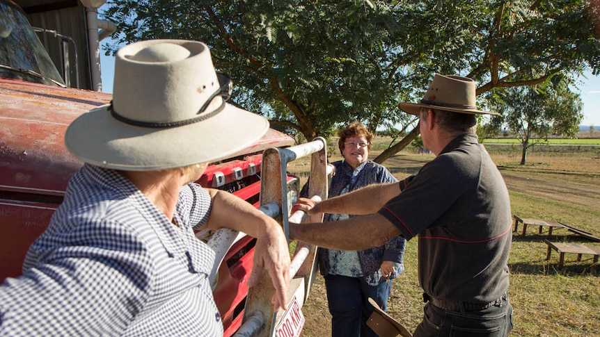 Sister Christine Henry speaking with farmers in south-west Queensland.