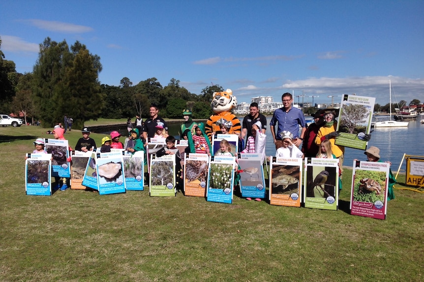 Members of the Parramatta River Catchment group on the riverbank.