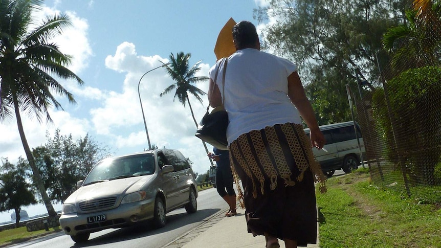 Pedestrians walking in a street in Nuku'alofa