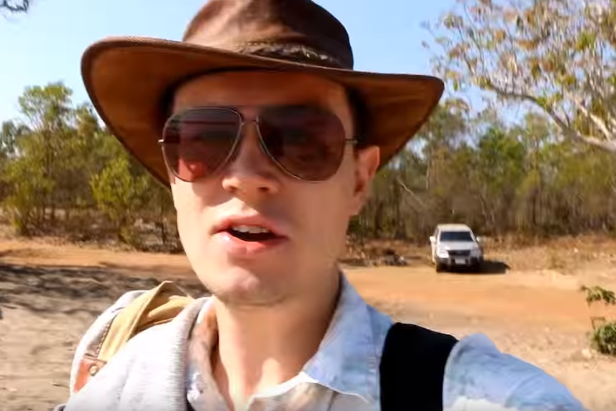 A man with a hat and white t-shirt in outback Western Australia.