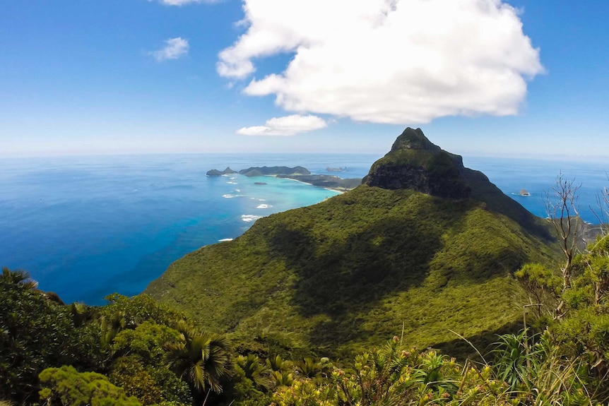 A view from a mountain top, looking over an island.