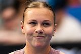 Amanda Anismova pumps her fist during the 2024 Australian Open.