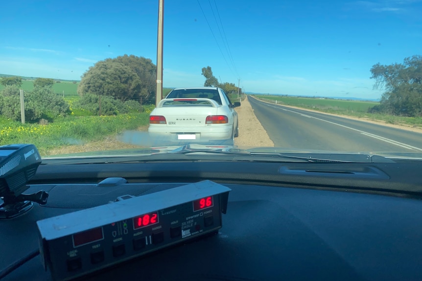 A Suburu WRX pulled over by police.