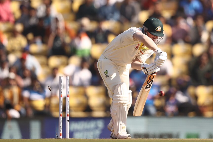 David Warner is bowled while playing a forward defence
