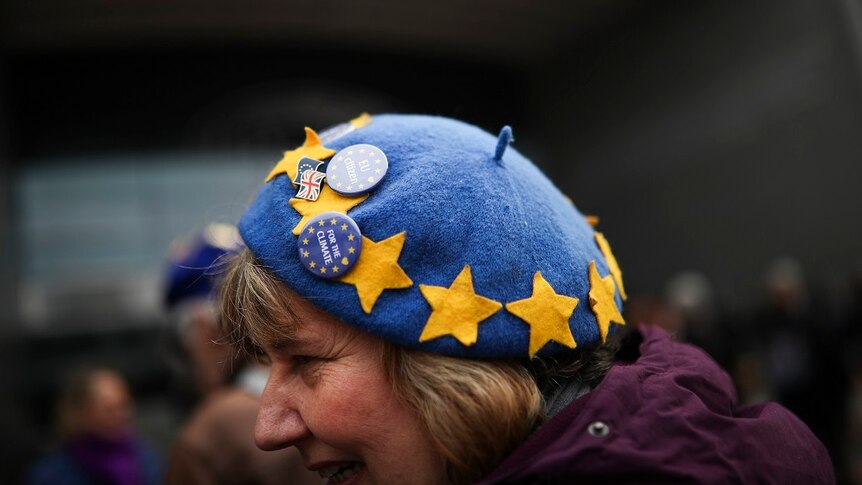 A woman wearing a hat with EU stars.