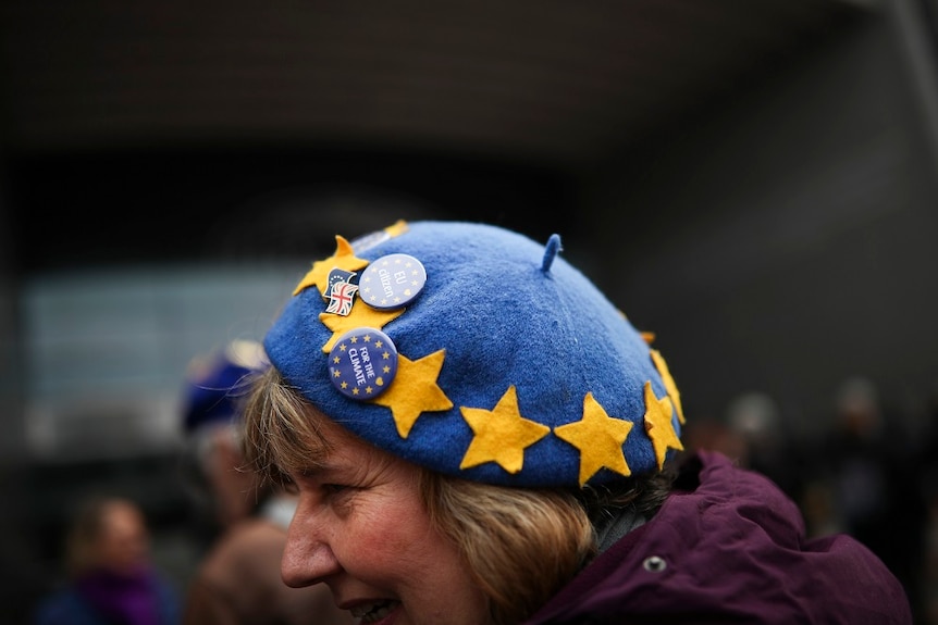 A woman wearing a hat with EU stars.