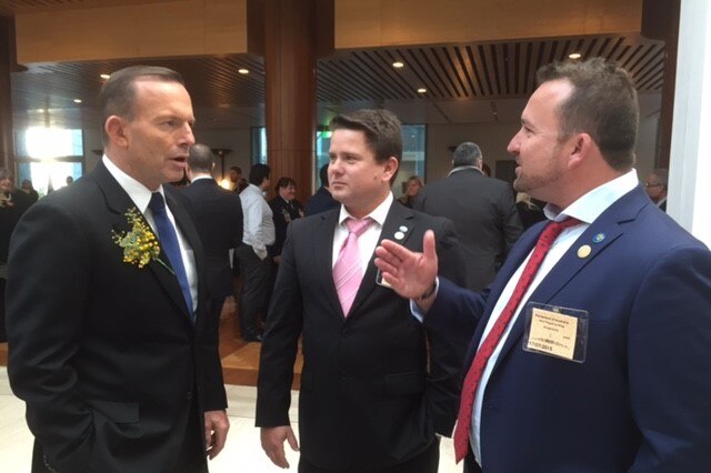 Former Prime Minister Tony Abbott speaking to Matthew and David Horder at Parliament house in Canberra