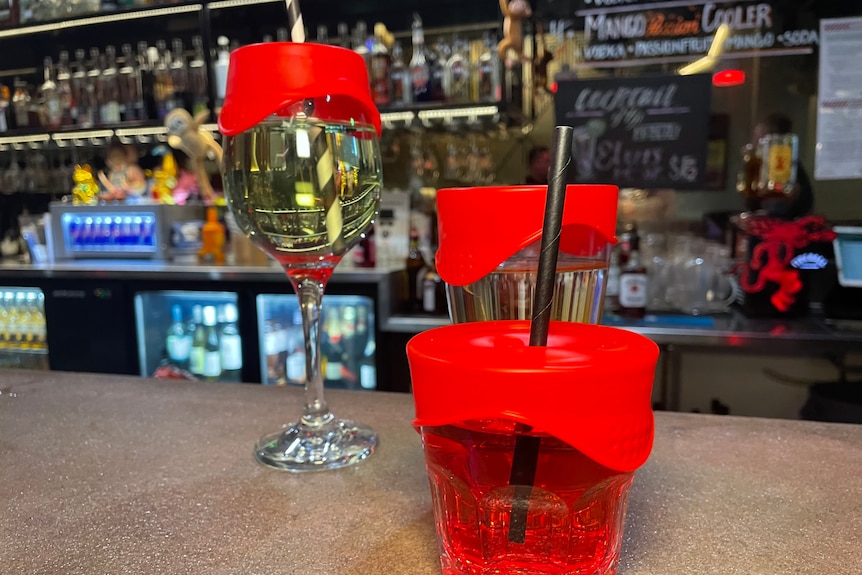 a cup with a red lid on it 