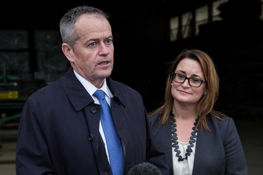 Bill Shorten stands with Justine Keay at a microphone.