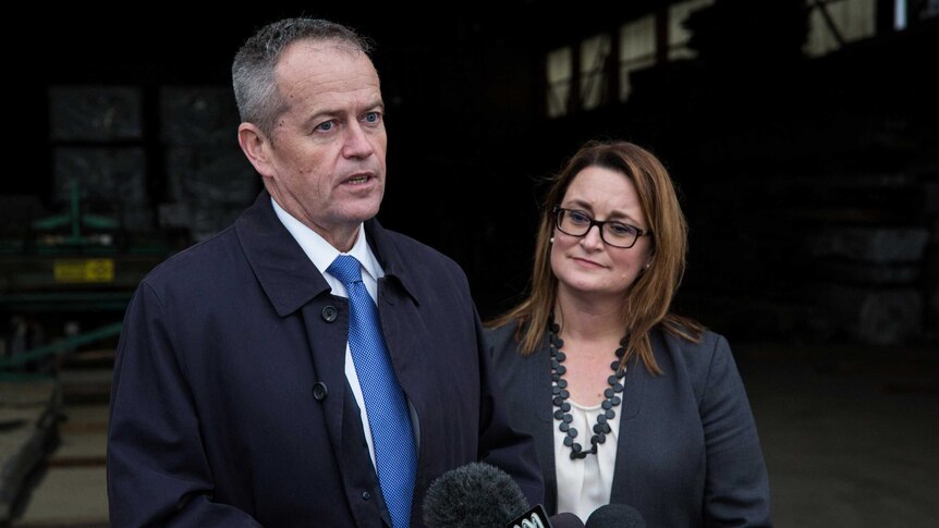 Bill Shorten stands with Justine Keay at a microphone.