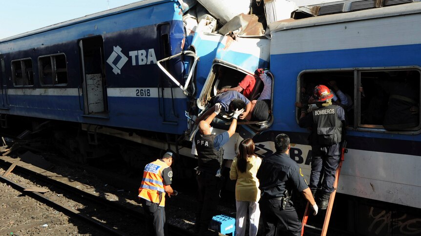 Rescuers work to save train crash victims
