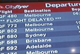 Qantas Cityflyer Departure sign showing flight to Melbourne delayed