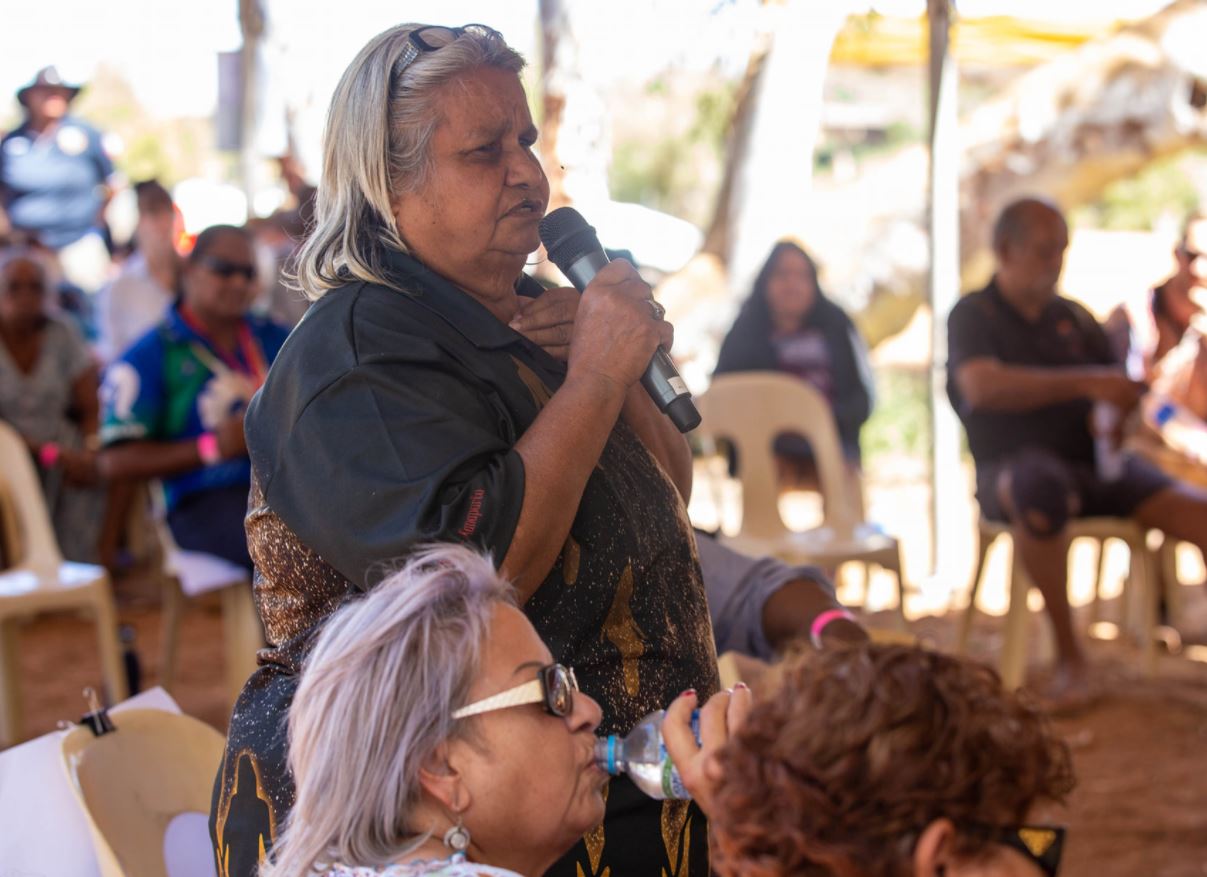 woman talking with microphone.