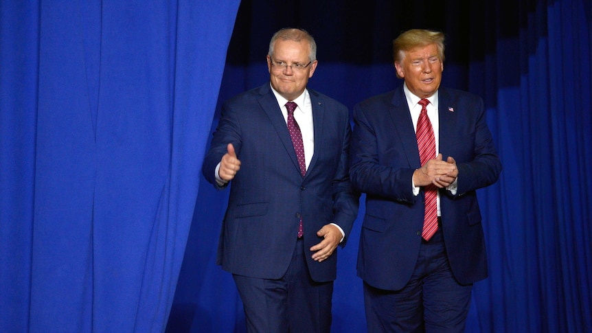 Two men in suits, one of them, Scott Morrison, giving a thumbs up