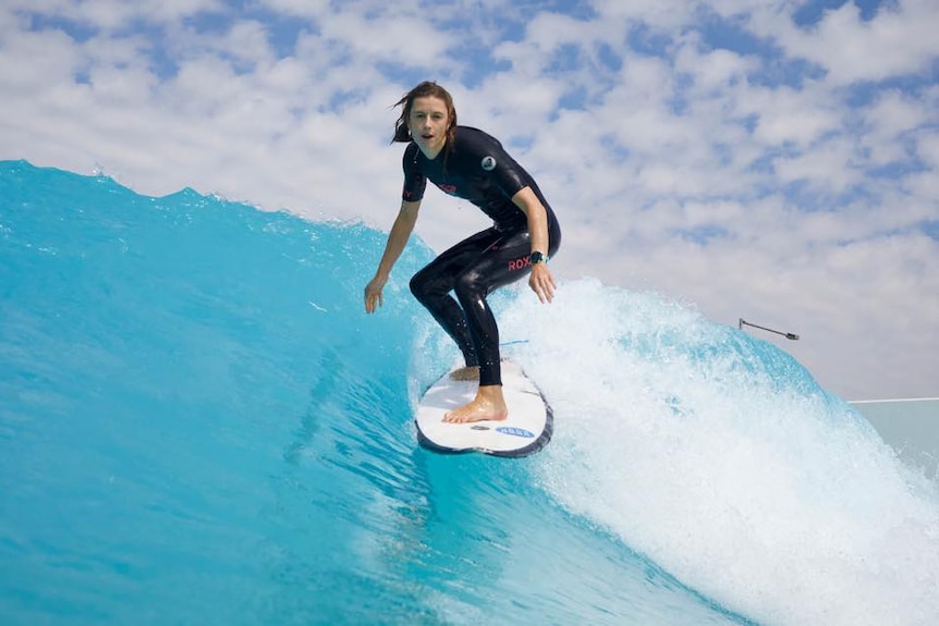 Female surfing a wave