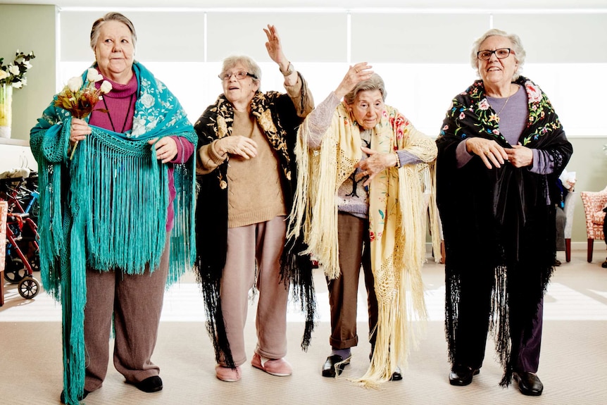 Four women draped in scarves dance the flamenco at Residential Gardens, Australia's only Spanish-speaking aged care home.
