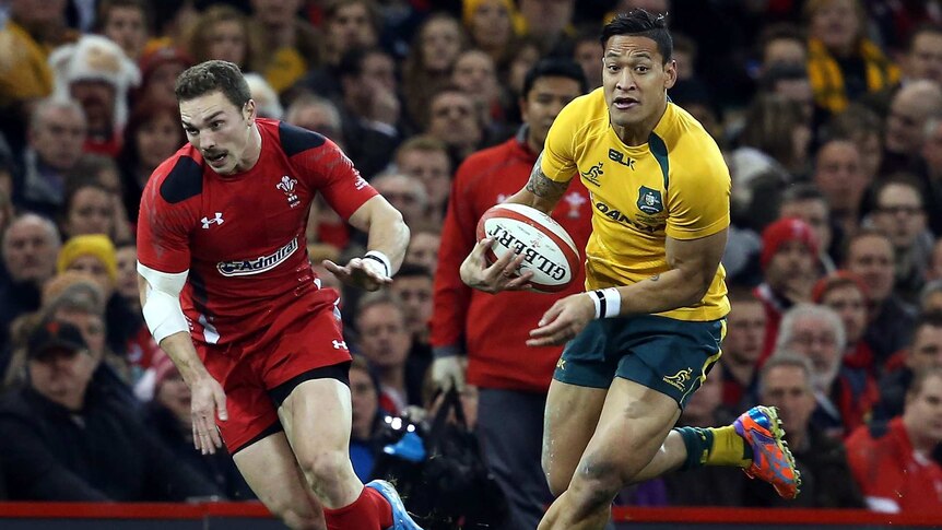 Israel Folau takes on the Welsh defence