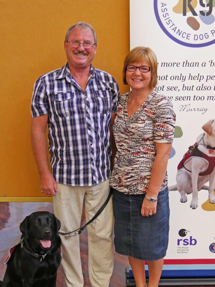 Peter and Jenny Checkley with PTSD service dog Ruby.