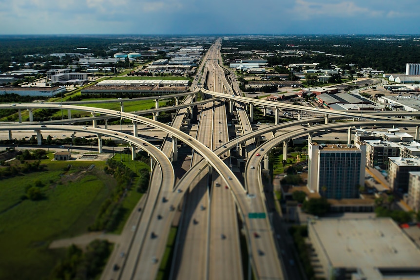 An aerial view of a large freeway interchange.