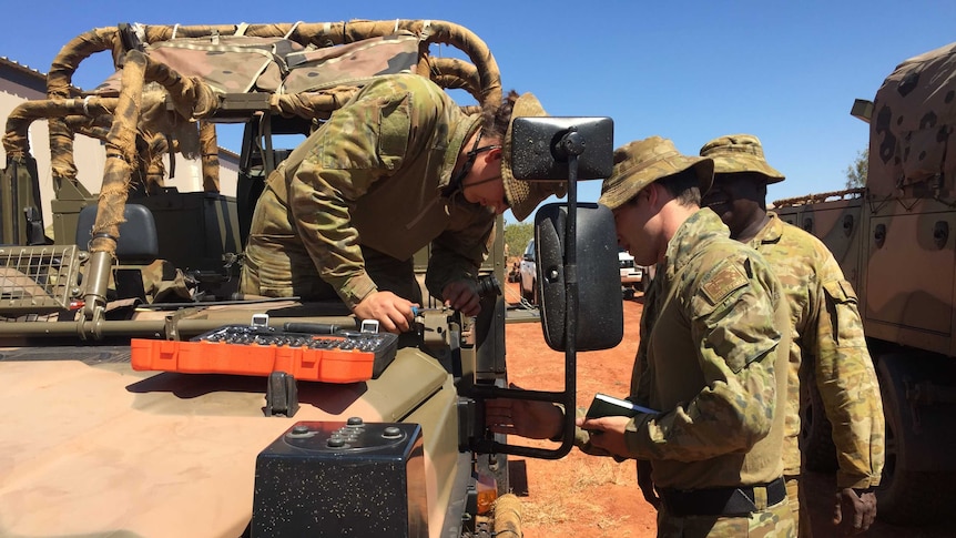 Norforce troops strip down their truck for field use during Exercise Southern Cross.