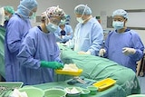 Surgeons performing an operation.